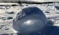 Snow cubes curled between Scottish fields