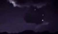 Spotlight next to a cloud of suspicious UFOs collecting storm energy