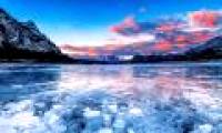 Stand in front of the cold beauty of frozen lakes