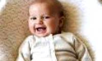 Strange baby grinning from the womb