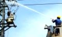 The image of electrician EVN cleaning the power line with high pressure water