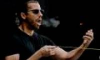 The magic magician catches the bullet flying by mouth