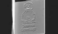 The world's smallest Christmas card is only half a strand of hair