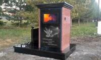 This is the first grave to install a TV to show videos of the deceased