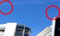 Video: Two spherical objects flying through the Malaysian sky cause a fever