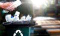 What happens to a plastic bottle after being thrown into the trash?