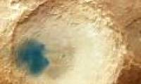 What is the small green spot on Mars's surface?