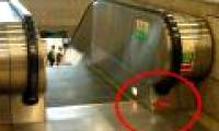 Where is the escalator 'emergency stop' button located?