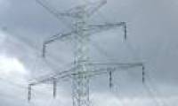 Why are power transmission lines and electric pylons not short-circuited when it rains?