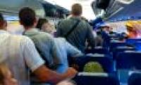 Why do passengers have to wait long before leaving the plane?