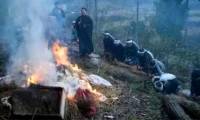 Why do people burn clothes after death?
