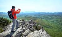 Why do people see mountains in the distance blue?