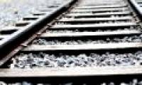 Why do people spread stones along railroad tracks?