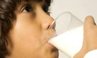 Why does milk reduce the effectiveness of antibiotics?
