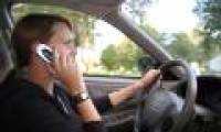 Why shouldn't a mobile phone be used while driving?